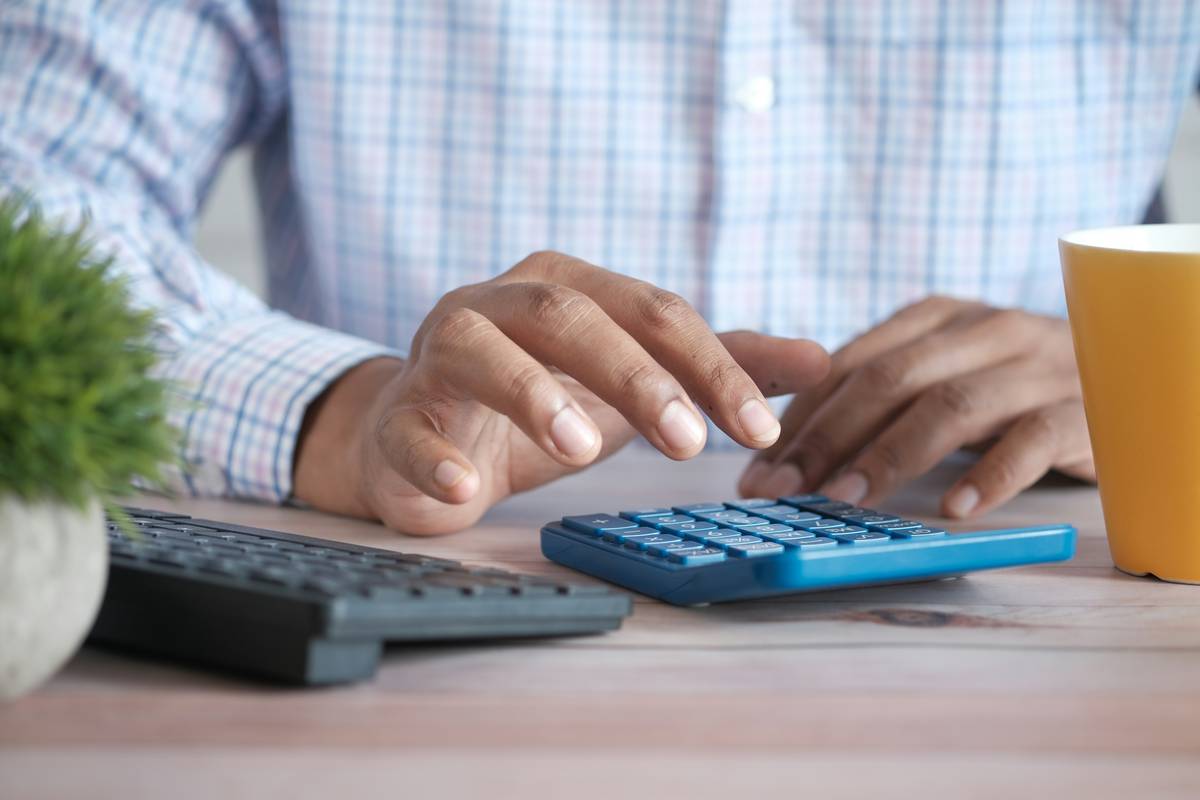 expense tracking for renters showing a renter reviewing monthly bills and categorizing expenses in a notebook
